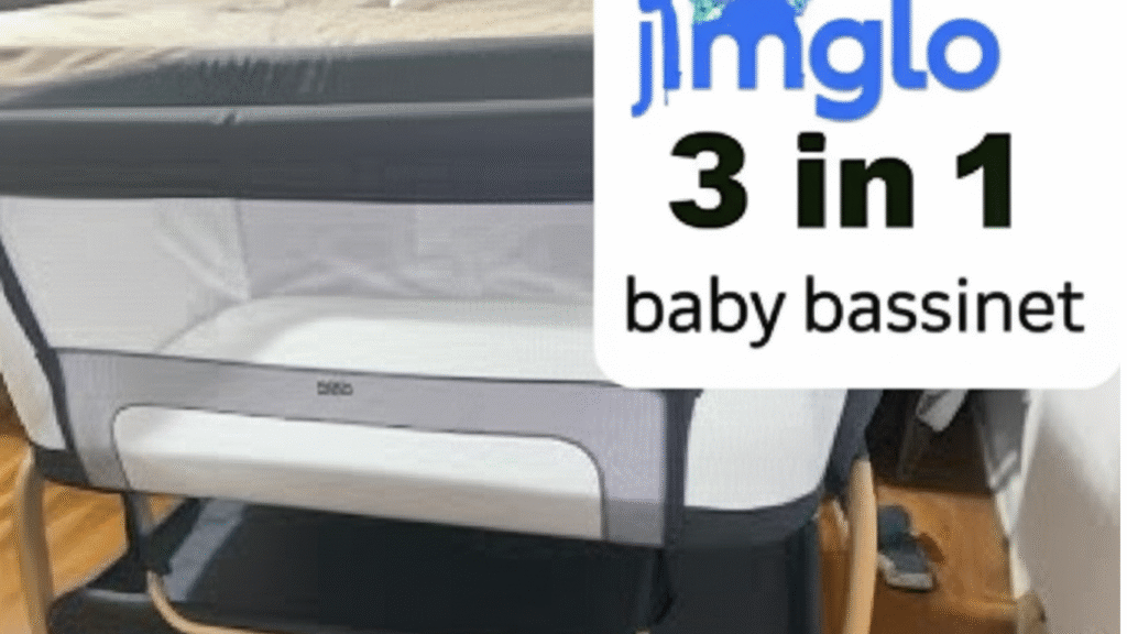 A picture of a Jinmglow 3-in-1 baby bassinet with the logo on the side. The bassinet is gray and white in color, with wooden legs